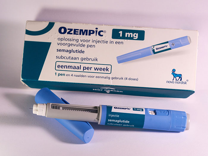Ozempic injection pen for semaglutide use, highlighting possible side effects linked to Nicole Scherzinger's transformation.