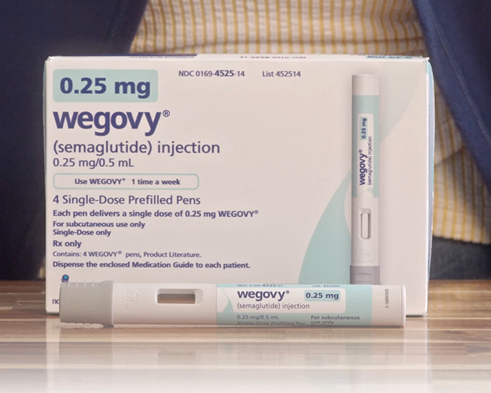 Wegovy semaglutide injection pen and box shown on table highlighting organ-destroying risks linked to Ozempic.