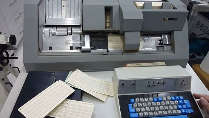 Vintage data processing machine with punch cards, showcasing obsolete skills people online needed before the 2000s.