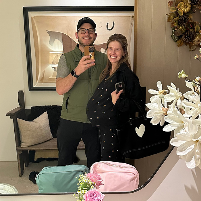 Chris Pratt taking a mirror selfie with a pregnant woman, sparking heated reactions after a callous Parks and Rec tribute.