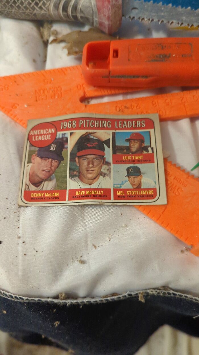 Vintage 1968 baseball card found among tools, one of the things people discovered in walls that really confused them.