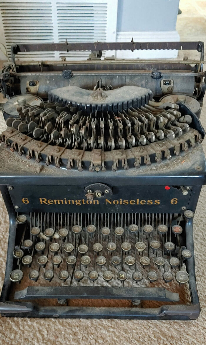 Old dusty Remington noiseless typewriter found in an unexpected place, a surprising thing people found in their walls or home.