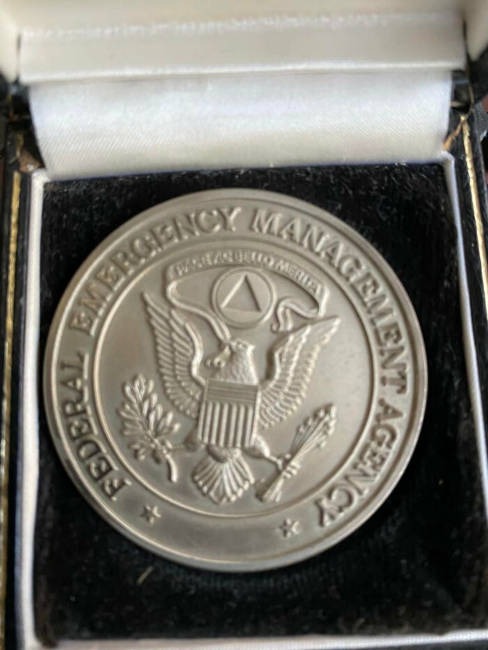 Federal Emergency Management Agency commemorative coin found in walls, surprising and confusing discovery for homeowners.