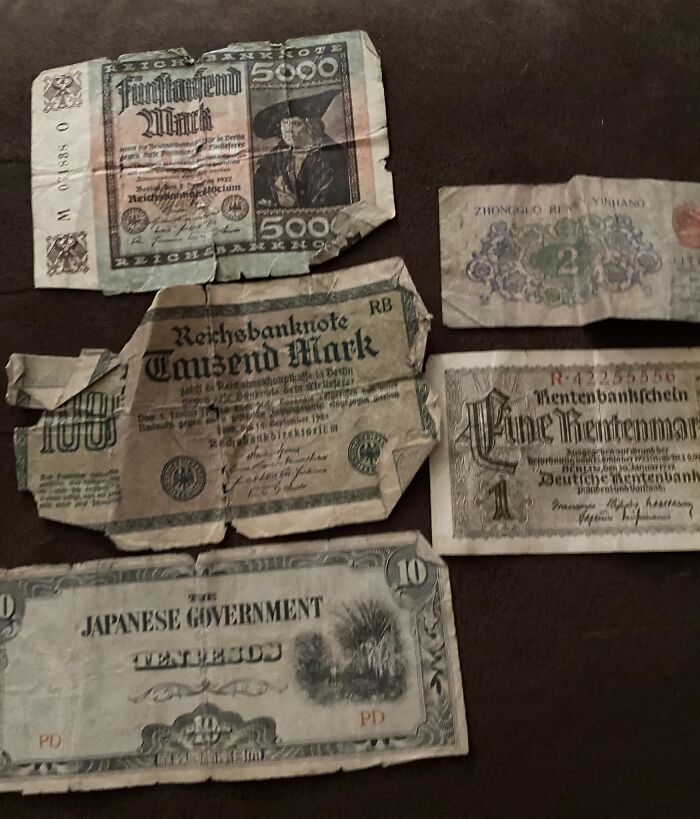 Old and rare vintage currency found hidden in walls, showcasing confusing historical banknotes from different countries.