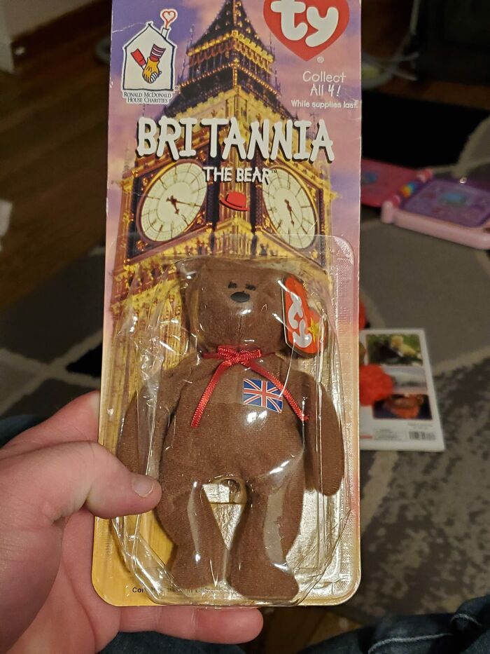 Brown Britannia the Bear collectible toy with UK flag, found among things that confused people in walls or other places.
