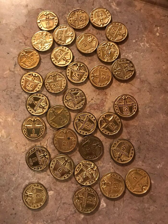 Collection of vintage president coins found in walls, showcasing unique designs and numbers on each coin.