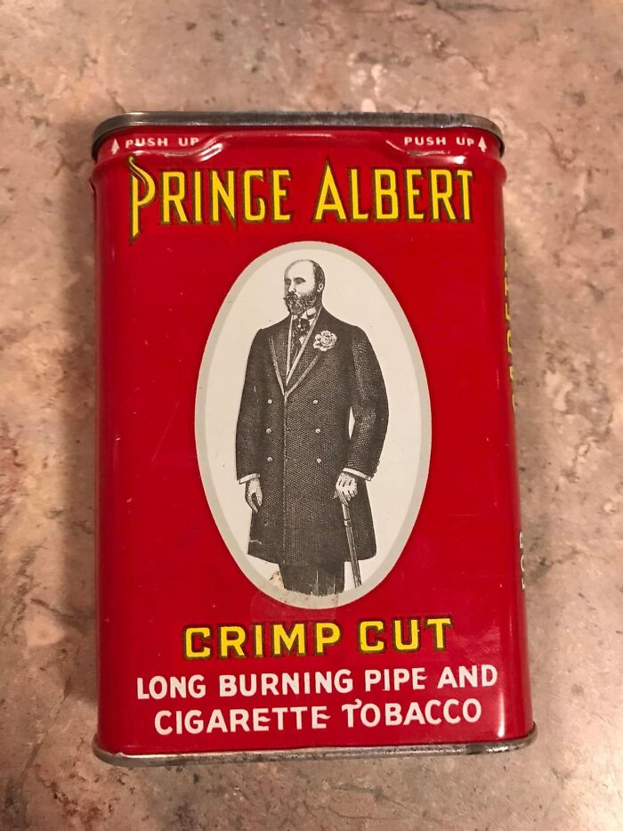 Vintage Prince Albert tobacco tin found inside a wall, a surprising item that confused many during hidden discoveries.