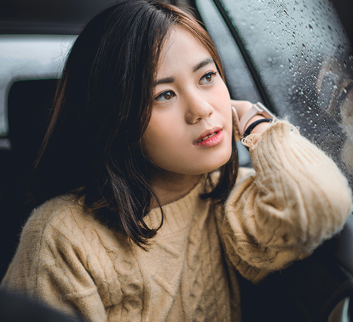 Young woman looking out a rainy car window, reflecting on a Bible-based revenge plan against a religious couple. Young woman looking out a rainy car window, reflecting on a Bible-based revenge plan against a religious couple.