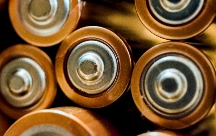 Close-up of several batteries stacked together representing the concept of a social battery energy level.
