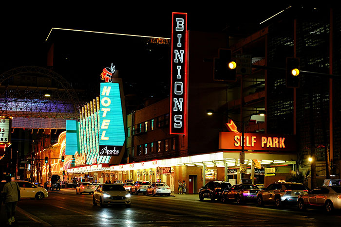 Las Vegas street at night featuring Binion’s and Apache Hotel neon signs, capturing the city’s vibrant nightlife scene. Las Vegas street at night featuring Binion’s and Apache Hotel neon signs, capturing the city’s vibrant nightlife scene.
