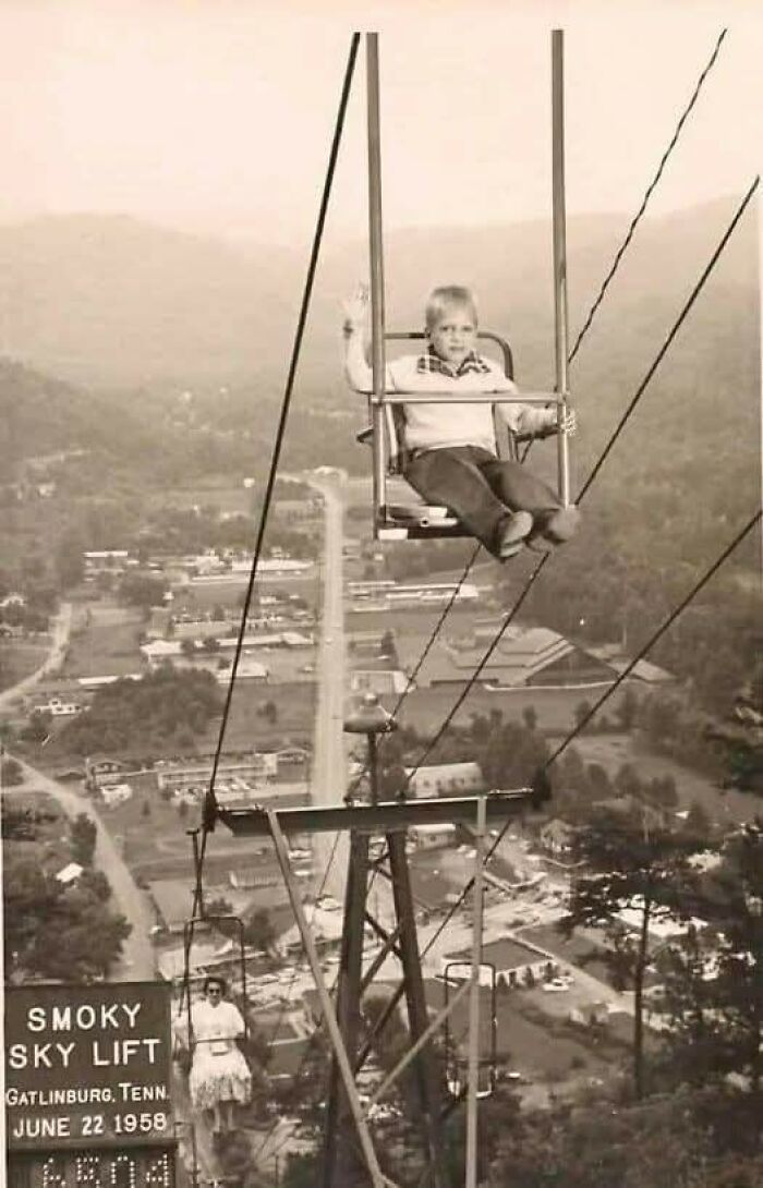 Child and woman riding the Smoky Sky Lift in Gatlinburg, Tennessee, a timeless photo showing what the past looked like in 1958.