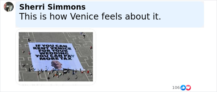 Aerial view of a large protest banner criticizing Jeff Bezos' lavish wedding in Venice, with people gathered around it. Aerial view of a large protest banner criticizing Jeff Bezos' lavish wedding in Venice, with people gathered around it.