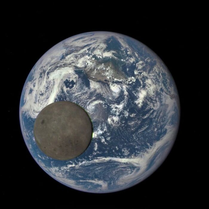 Earth and its moon captured from space showing alternative angles and unseen perspectives in a celestial view with clouds and landmasses.