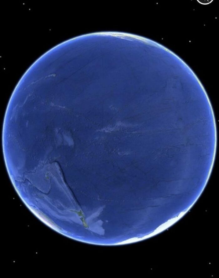 Unseen alternative angles of Earth showing vast ocean and distant landmasses against the backdrop of space stars.