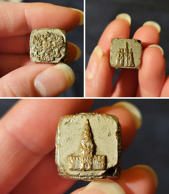 Three close-up views of a small metal mystery object with intricate embossed designs held between fingers.