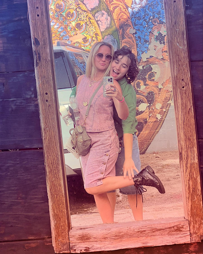 Pitch Perfect star and girlfriend posing happily in front of a large decorative mirror, showing affection despite 18-year age gap.