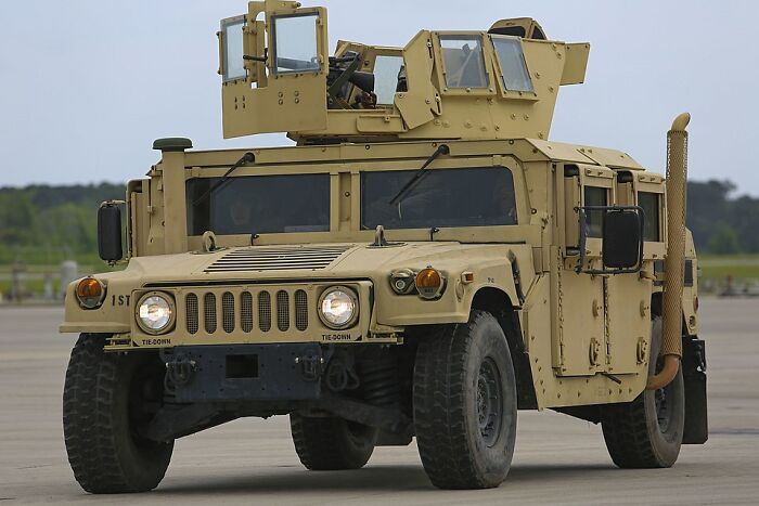 Armored military vehicle on runway, illustrating toughness and resilience in rich kid meltdowns at private schools.