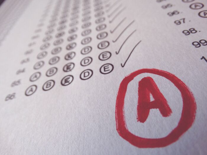 Scantron test sheet with a red A grade circled, illustrating rich kid meltdowns at private schools concept.