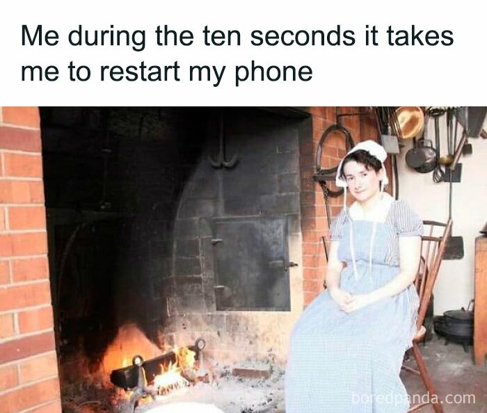 Person dressed in historical clothing sitting calmly by a fireplace, illustrating stress relief in hilarious memes context.