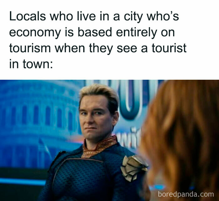 Character from The Boys wearing a blue suit with a skeptical expression in a humorous meme about tourism.