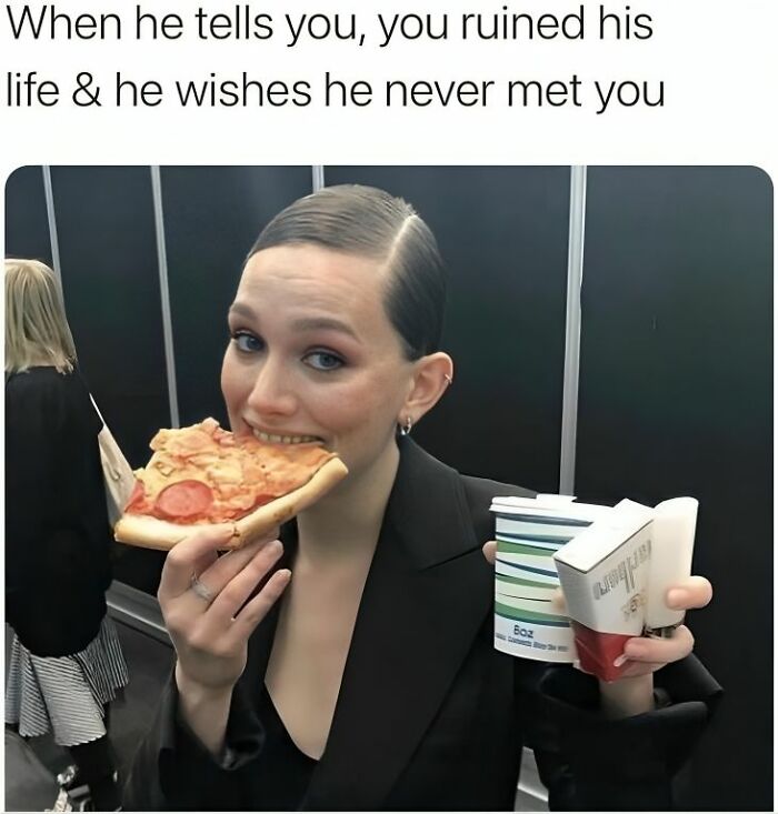 Woman in black blazer eating pizza and holding fast food, reacting to a humorous meme about life stress and relationships.