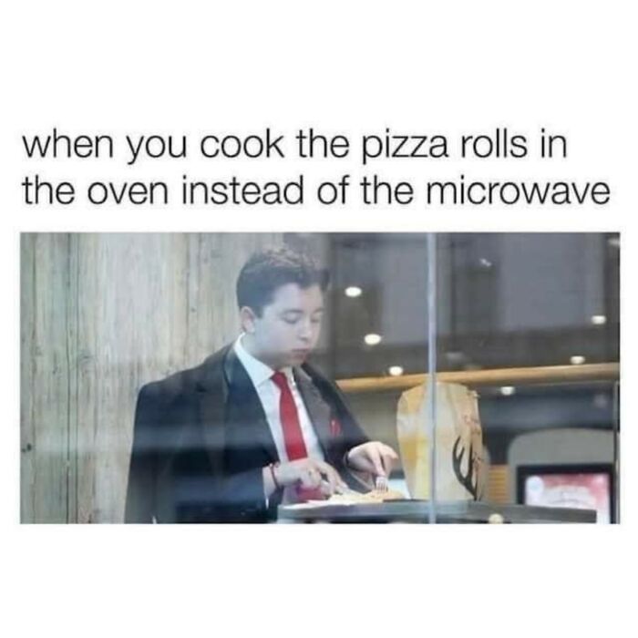 Man in suit eating pizza rolls at a table with a paper bag, a funny meme about decompressing with hilarious memes.