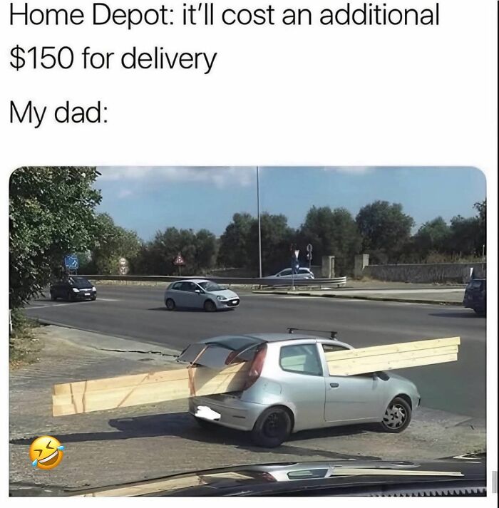 Small car carrying long wooden planks through windows as a funny meme to help decompress stress.