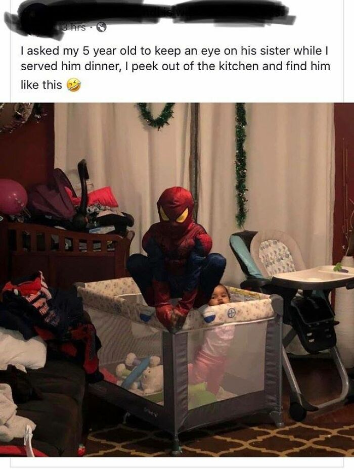 Child in a Spider-Man costume watching a baby in a playpen, a wholesome meme moment to share with favorite people.