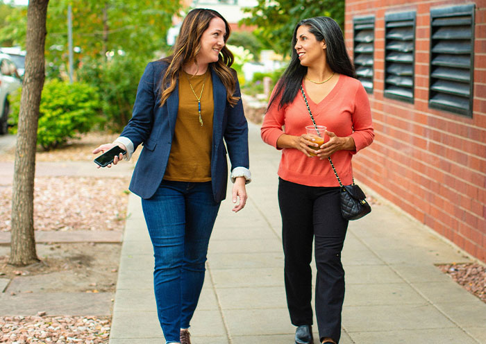 Two women walking outside, engaged in conversation, illustrating refusal to babysit niece after SIL's rudeness. Two women walking outside, engaged in conversation, illustrating refusal to babysit niece after SIL's rudeness.