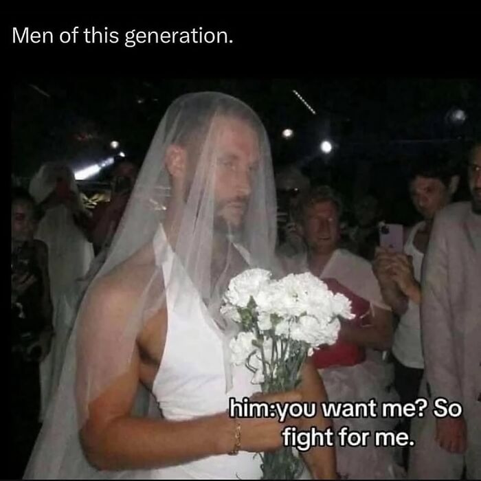 Man wearing a bridal veil and holding flowers with text about men in this generation, relatable meme on navigating the world as a woman today.