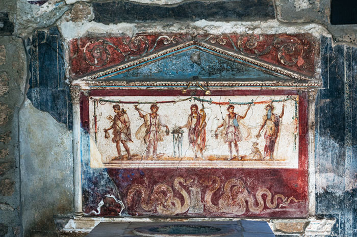 Ancient Roman comic paintings on a wall depicting figures and illustrations revealing the humorous side of the empire.