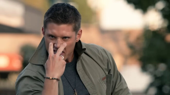 Actor making intense gesture in a dramatic scene representing some of the most tragic losses in TV show history