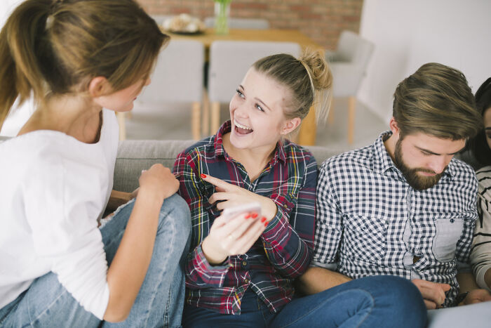 Three friends sharing raw and emotional confessions while sitting together in a cozy living room setting.