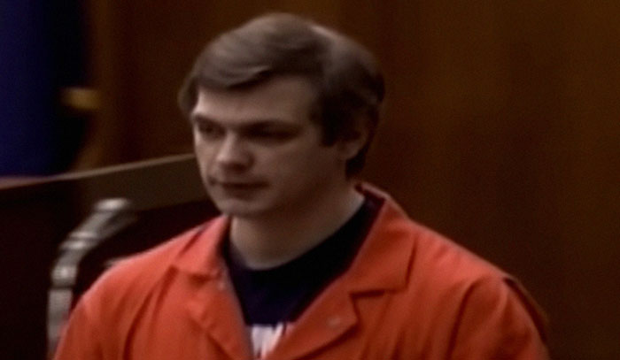Man in an orange prison jumpsuit appearing in a courtroom during one of the most shocking moments on live television.