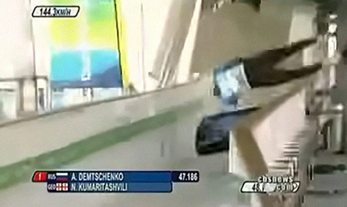 Athlete mid-air during a shocking live television moment in a high-speed sports event broadcast.