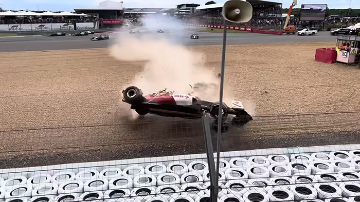 Race car flipping in a dramatic crash during a high-speed event, one of the most shocking moments on live television.