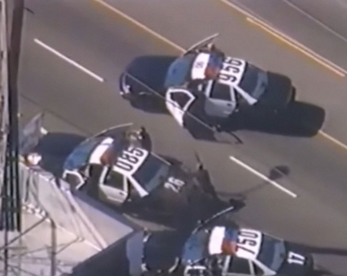 Aerial view of police cars blocking a street during one of the most shocking moments on live television.