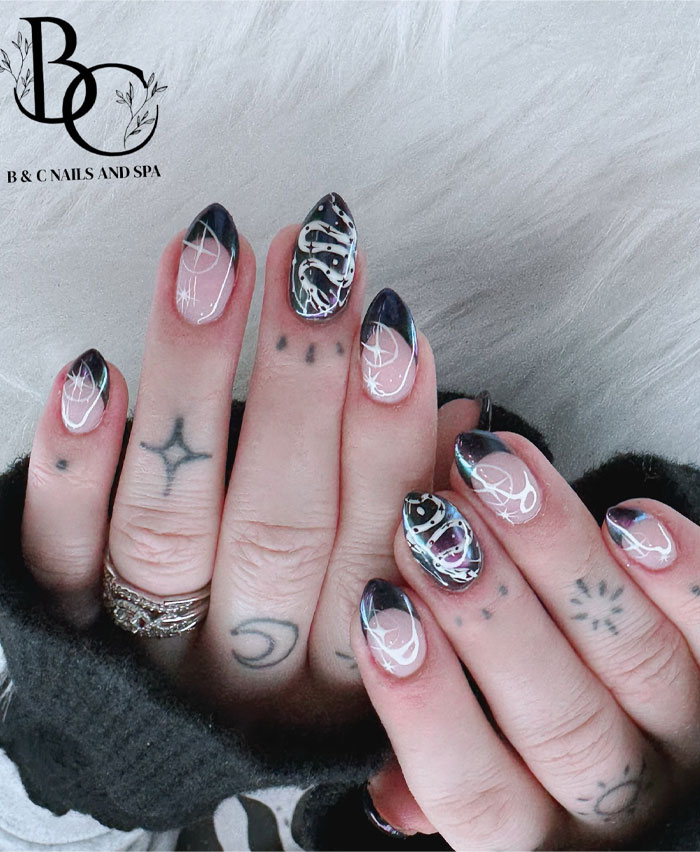 Short French tip nails with unique black and white design on oval-shaped nails, styled for 2025 fashion trends. Short French tip nails with unique black and white design on oval-shaped nails, styled for 2025 fashion trends.