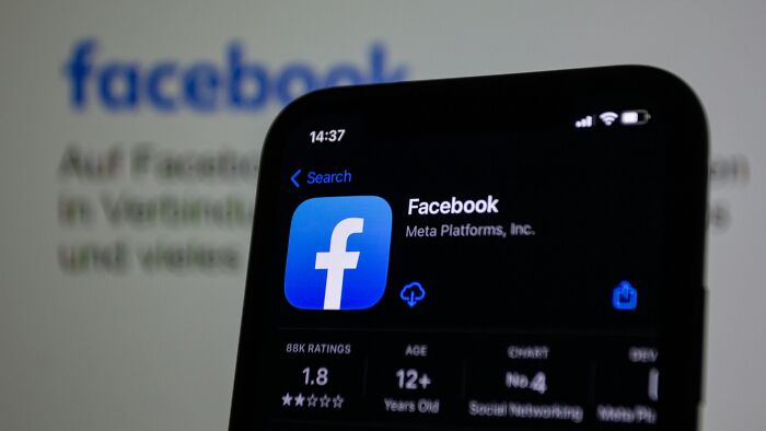 Facebook app on a smartphone screen showing low ratings, hinting at a good trend slowly disappeared in social networking.