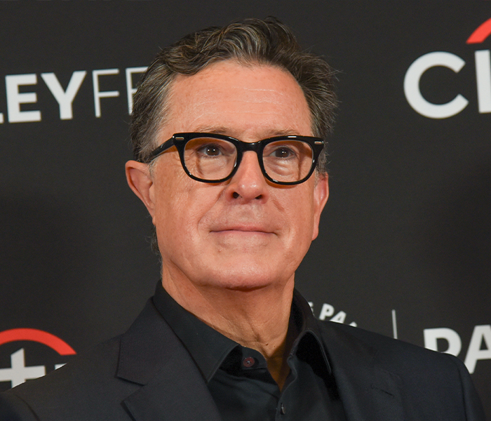 Middle-aged man with glasses at an event, illustrating bizarre celebrity body anomalies that left fans speechless.