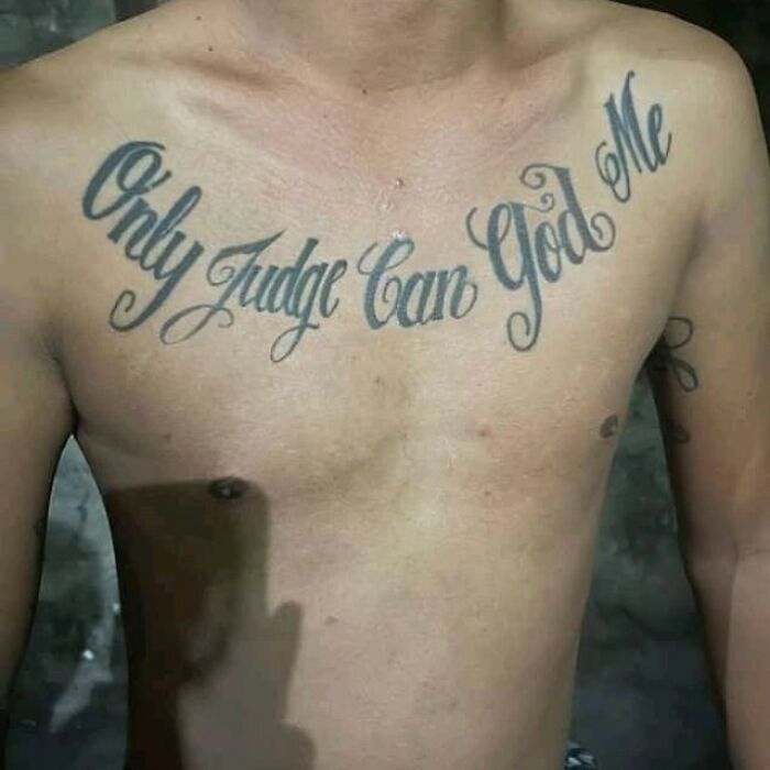 Chest tattoo with the phrase Only Judge Can God Me showcasing bizarre choices people made while getting tattoos.