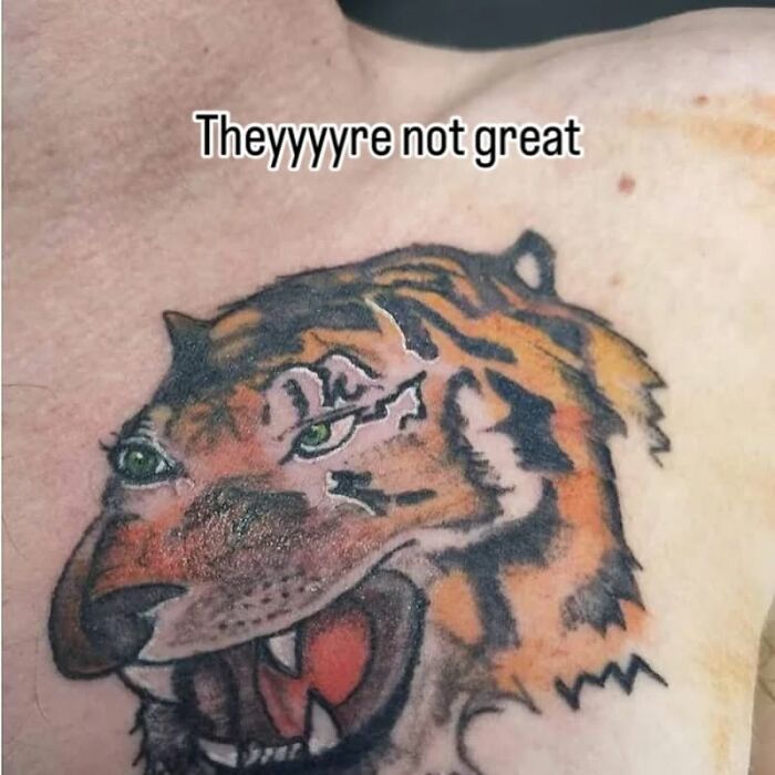 Tattoo of a poorly drawn tiger face on a person's chest, showcasing one of the bizarre choices people made while getting tattoos.