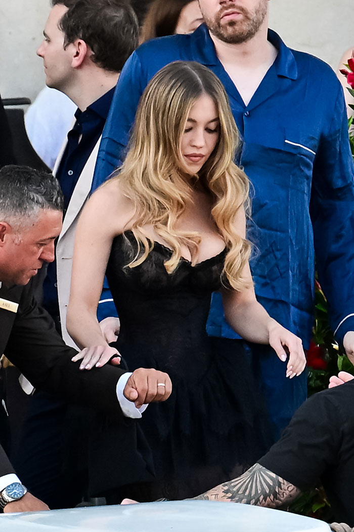 Lauren S&aacute;nchez in a revealing black outfit at Jeff Bezos pajama-themed afterparty, featuring racy and stylish looks.