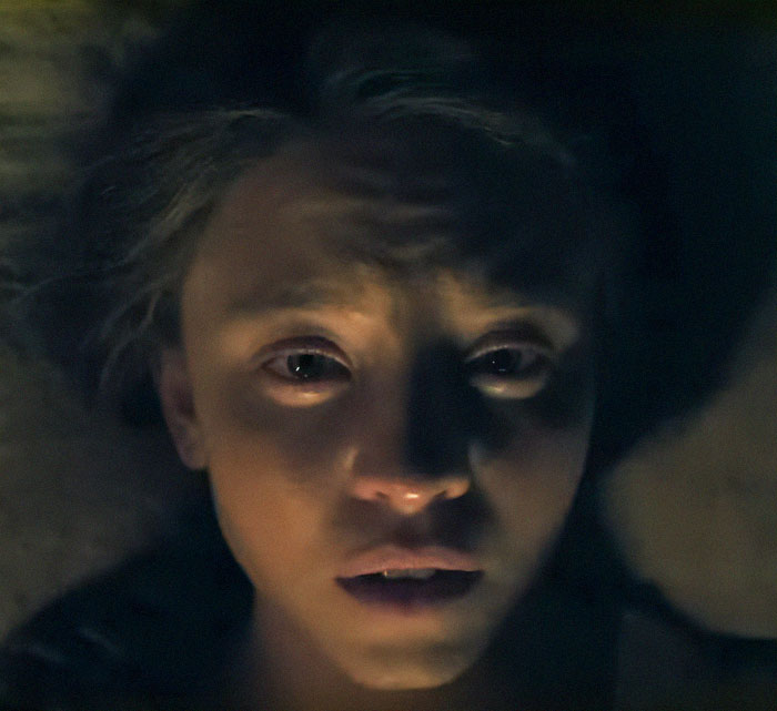 Sydney Sweeney with a dramatic makeover in a dark, intense scene from the survival thriller Eden.