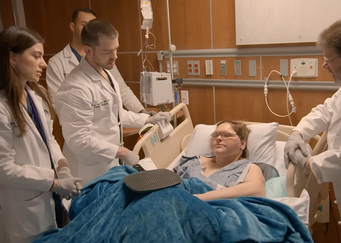 Patient from 1000-lb Sisters in hospital bed surrounded by medical staff after a shocking transformation surgery. Patient from 1000-lb Sisters in hospital bed surrounded by medical staff after a shocking transformation surgery.