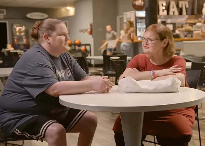 Two '1000-lb Sisters' stars sitting at a round table in a casual setting, discussing recent life changes. Two '1000-lb Sisters' stars sitting at a round table in a casual setting, discussing recent life changes.