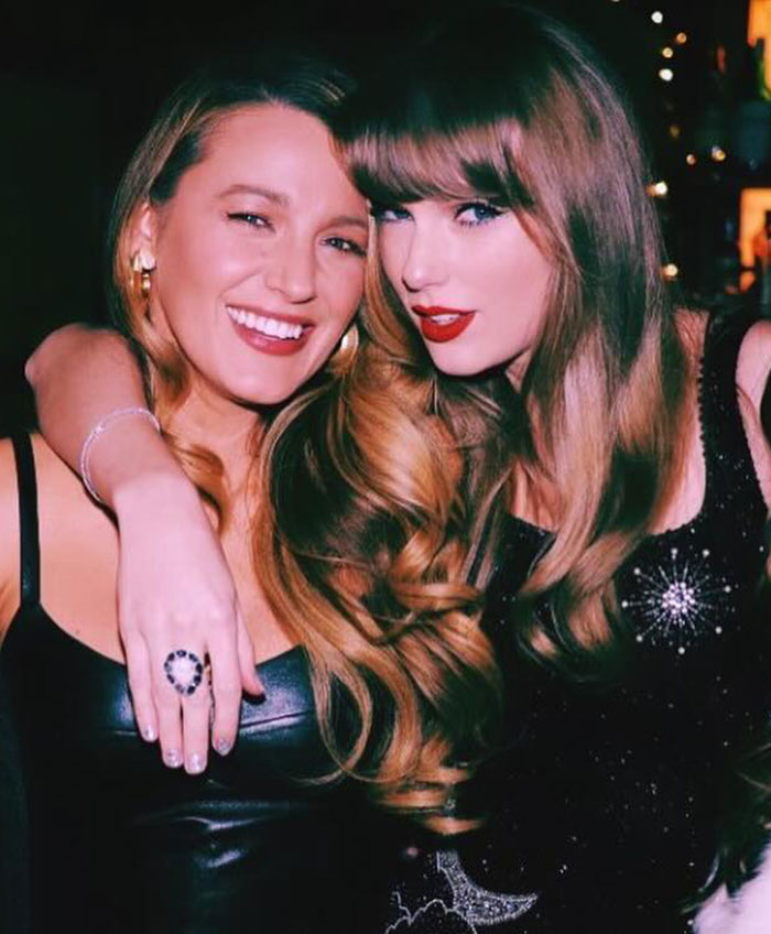 Taylor Swift and Blake Lively posing together at an event, showcasing a close friendship moment. Taylor Swift and Blake Lively posing together at an event, showcasing a close friendship moment.