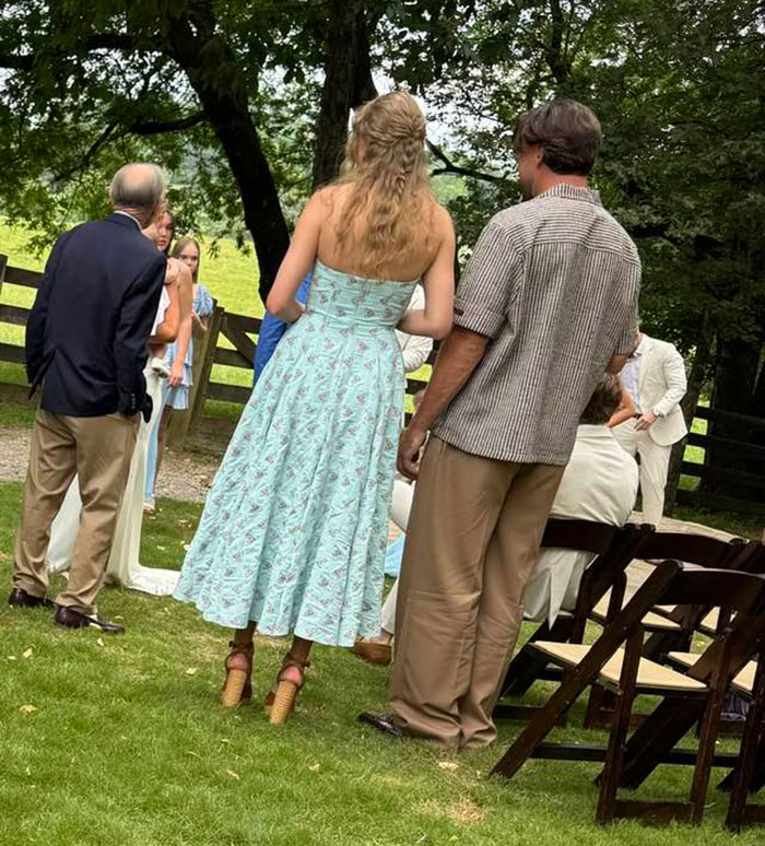 Guests gathered outdoors at a casual event, sparking rumors about Taylor Swift and Travis Kelce secret marriage.