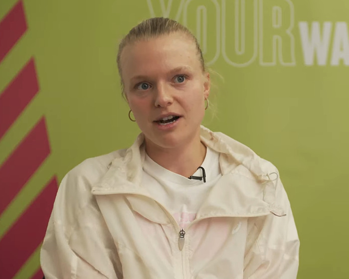 Tennis star speaking during interview, addressing opponent comment on her odor mid-match with serious expression.