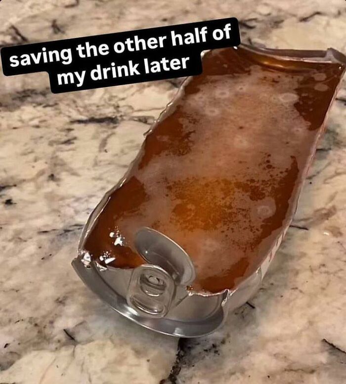 Crushed soda can filled with stagnant liquid on granite surface depicting disgusting food pics that might ruin appetite.